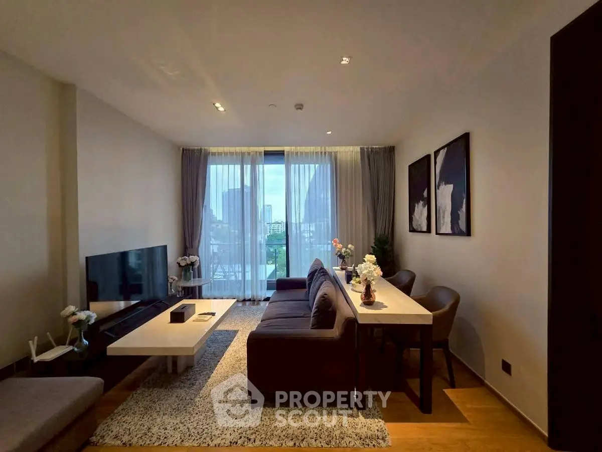 Modern living room with city view, stylish furniture, and elegant decor