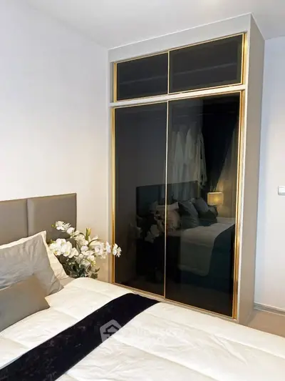 Luxurious bedroom with elegant wardrobe and plush bedding, perfect for modern living.