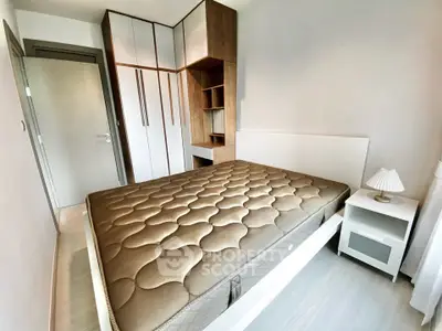 Modern bedroom with stylish wardrobe and cozy bed in a contemporary apartment.