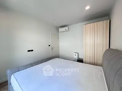 Spacious bedroom with modern design and ample natural light