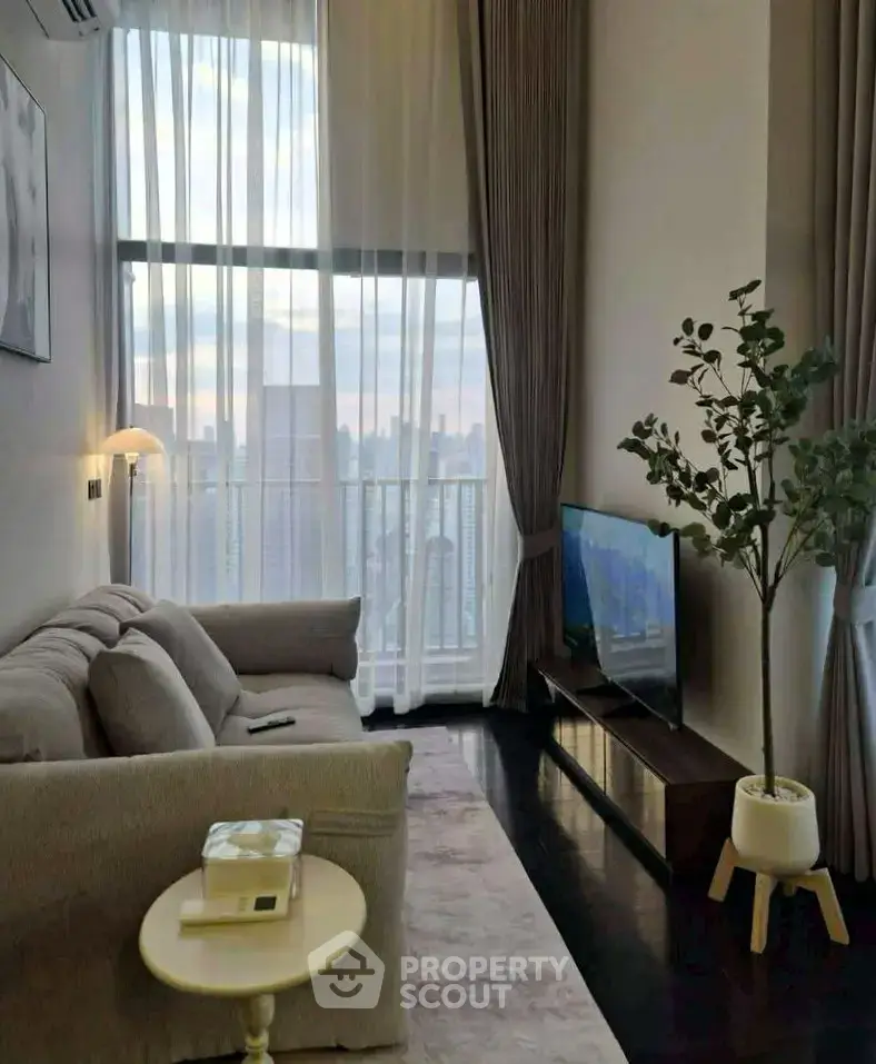 Luxurious high-rise living room with stunning city view and elegant decor.