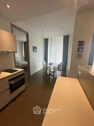 Modern open-plan kitchen and dining area with sleek design and natural light.