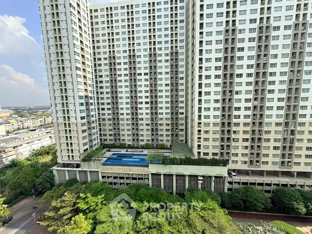 Stunning high-rise building with lush greenery and pool view