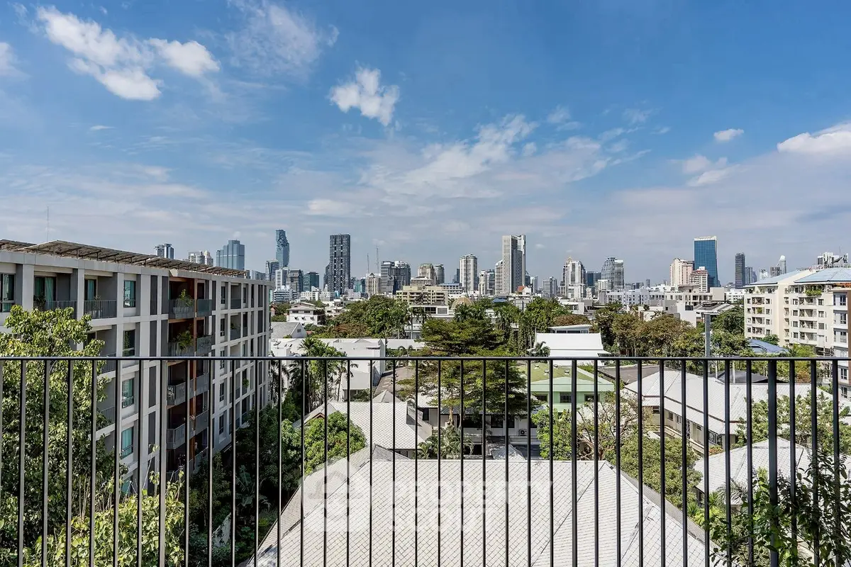 Stunning cityscape view from a modern balcony overlooking urban skyline.