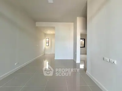 Spacious modern interior with sleek tile flooring and neutral walls