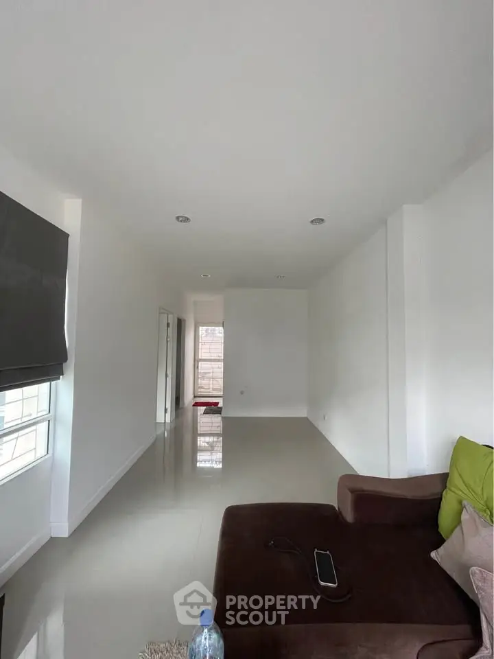 Spacious modern living room with sleek design and natural light