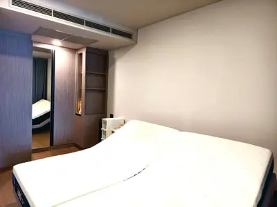 Modern bedroom with adjustable bed and sleek wooden accents