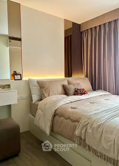 Cozy bedroom with elegant decor and soft lighting, featuring a plush bed and stylish curtains.