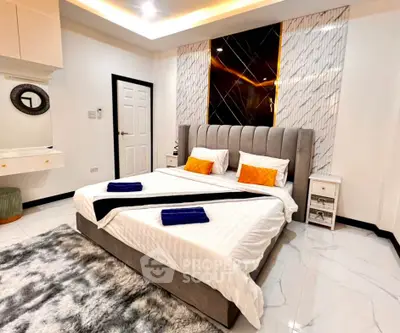 Luxurious modern bedroom with plush bed and elegant decor