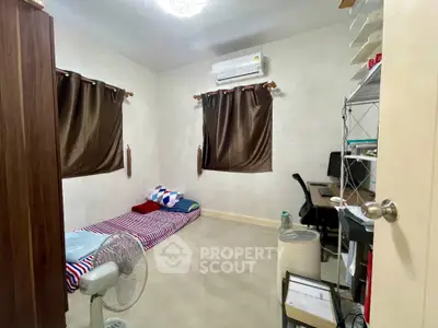 Cozy bedroom with minimalist decor and air conditioning