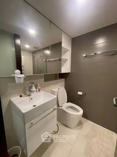 Modern bathroom with sleek fixtures and ample lighting