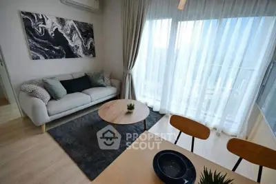 Modern living room with stylish decor and large window view