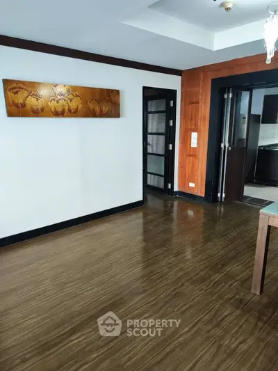 Spacious living room with wooden flooring and modern decor