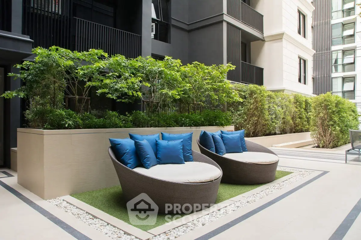 Luxurious outdoor seating area with modern design and lush greenery
