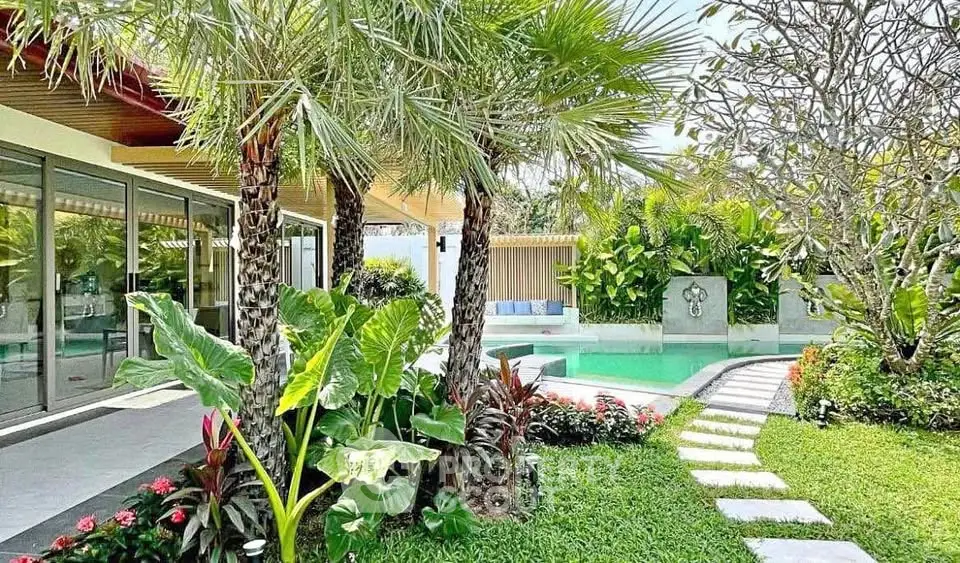 Luxurious tropical villa with lush garden and private pool, perfect for serene living.