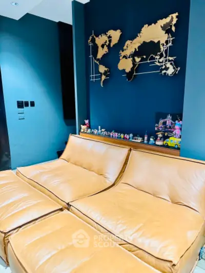 Stylish living room with modern leather sofa and world map wall art