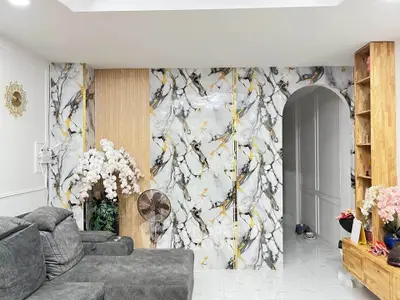 Stylish living room with marble accent wall and elegant decor