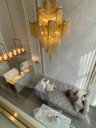 Luxurious living room with elegant chandelier and modern decor
