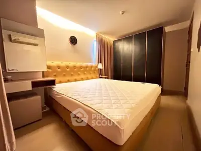 Spacious bedroom with modern design and ample storage space