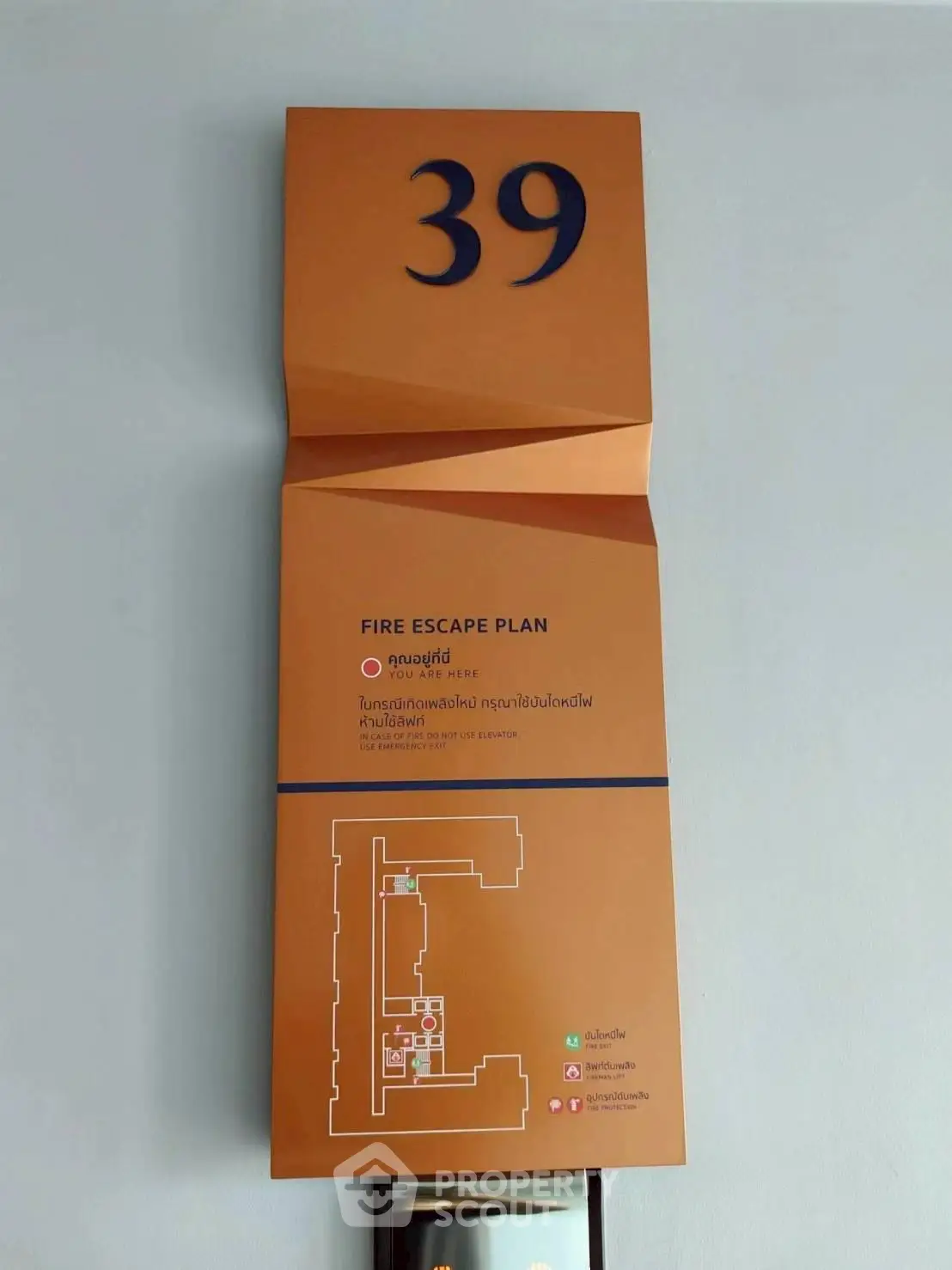 Fire escape plan on wall of high-rise building floor 39