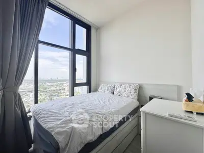 Modern bedroom with stunning city view and large window