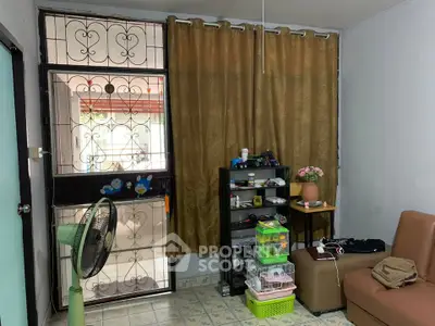 Cozy living room with brown curtains and organized shelves