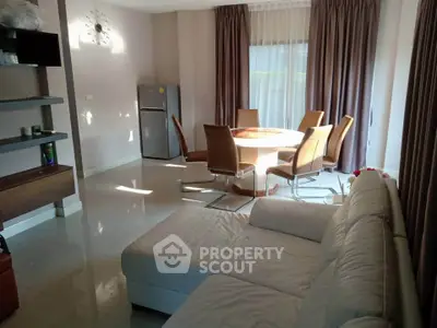 Spacious living room with modern furniture and natural light