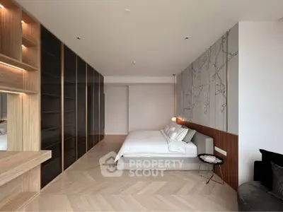 Luxurious modern bedroom with elegant design and spacious layout, featuring built-in storage and stylish decor.