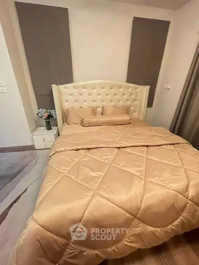 Luxurious bedroom with elegant tufted headboard and plush bedding