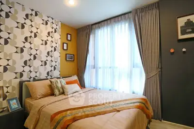 Stylish bedroom with modern decor and large window for natural light