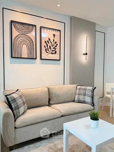 Stylish modern living room with elegant decor and cozy beige sofa, perfect for relaxation.