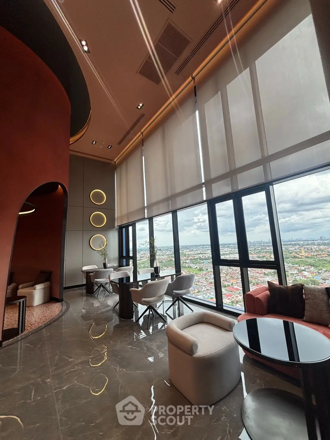 Luxurious high-rise living room with panoramic city views and modern decor