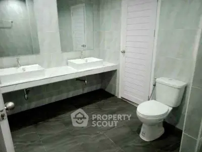 Spacious modern bathroom with dual sinks and sleek design