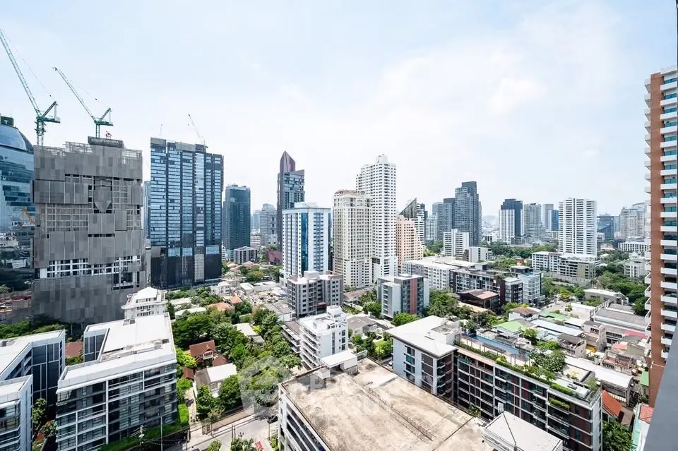 Stunning cityscape view from a high-rise building showcasing modern urban architecture and skyline.