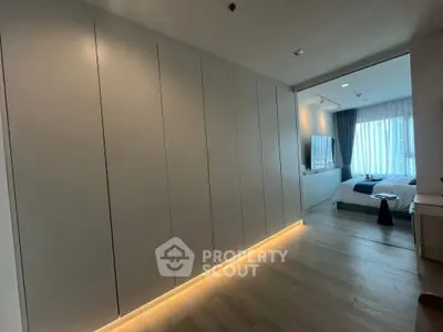 Modern bedroom with sleek design and ambient lighting