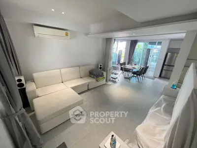 Spacious modern living room with open kitchen and dining area