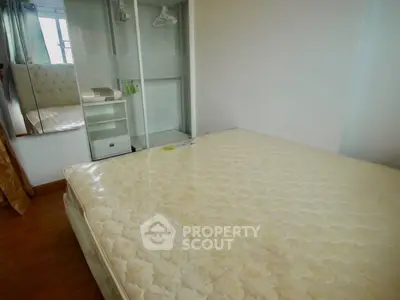 Cozy bedroom with mirrored closet and comfortable mattress in modern apartment.