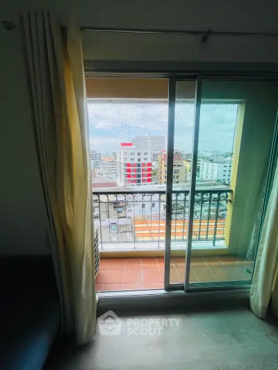 Charming apartment balcony with city view, perfect for urban living enthusiasts.