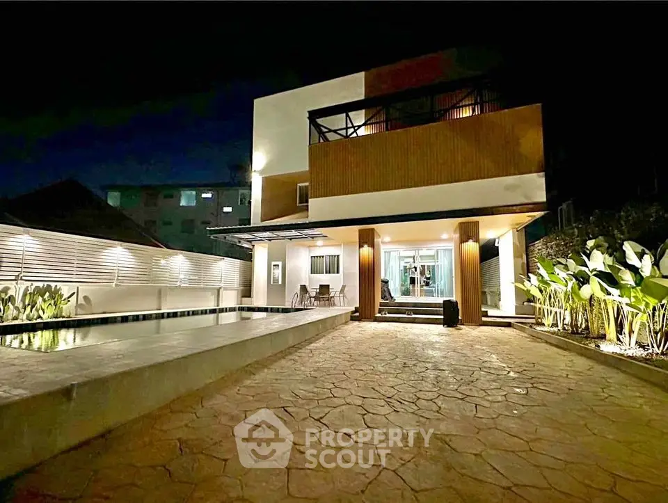 Stunning modern house with pool and elegant night lighting