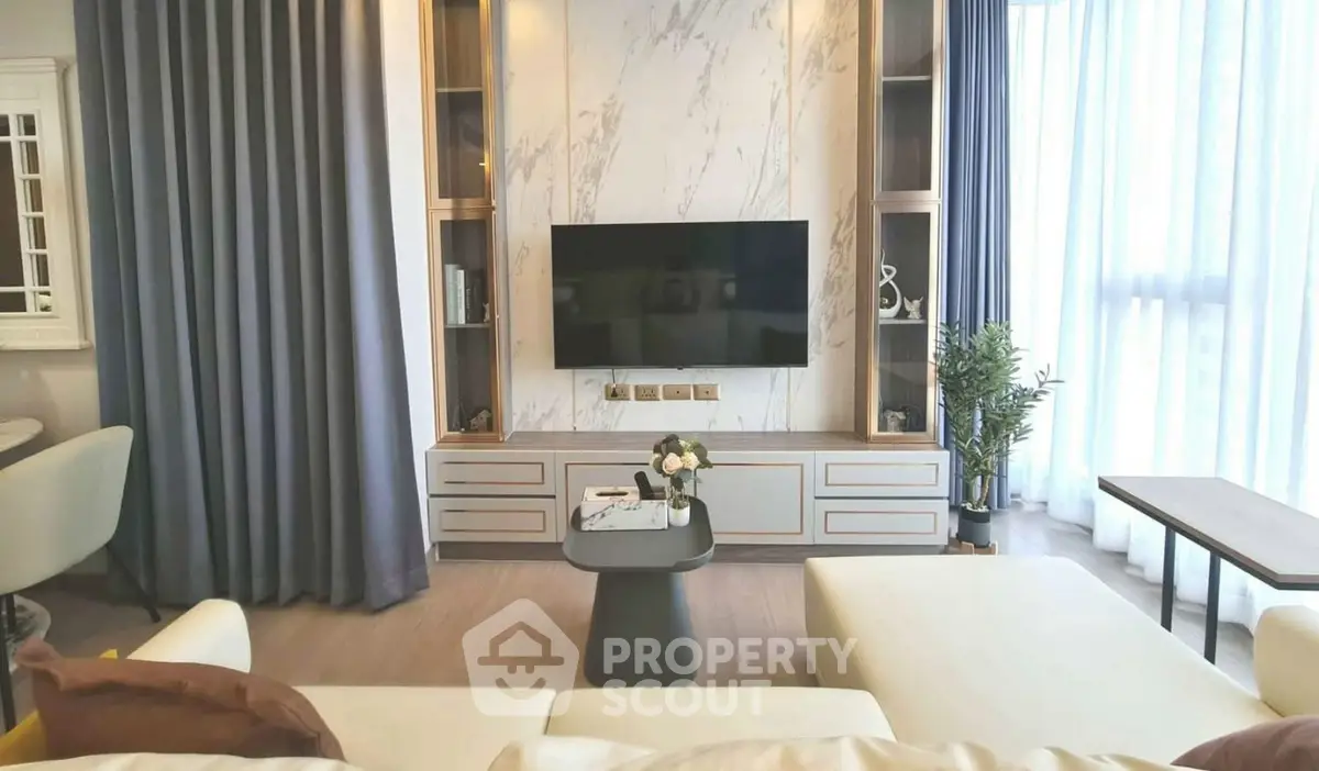 Luxurious modern living room with elegant marble TV wall and cozy seating area