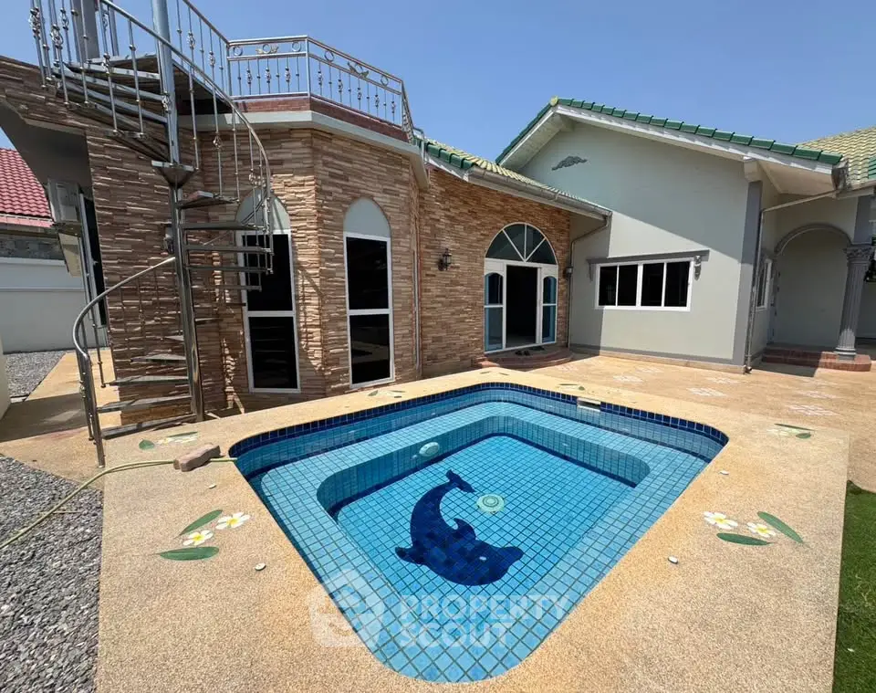 Charming villa with private pool and spiral staircase, perfect for luxury living.