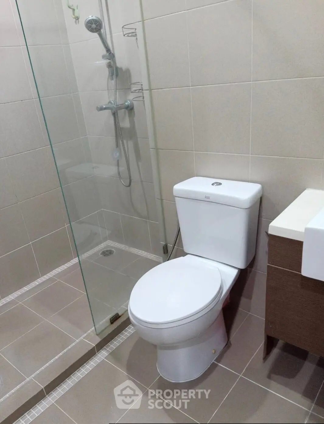 Modern bathroom with glass shower and sleek fixtures