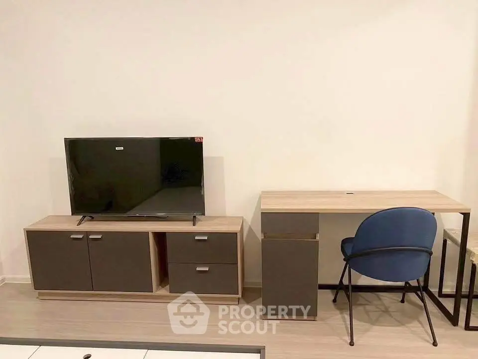Modern living room with sleek TV stand and stylish desk setup