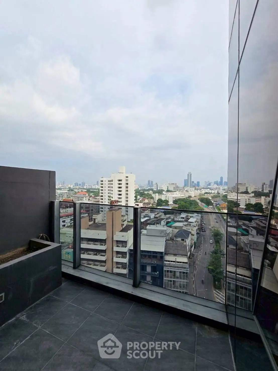Stunning cityscape view from modern high-rise balcony