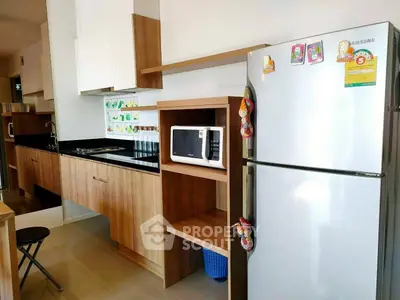 Modern kitchen with sleek wooden cabinets and stainless steel appliances