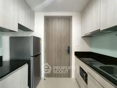 Modern kitchen with sleek cabinetry and stainless steel appliances