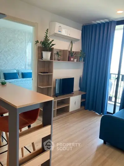 Modern living room with stylish furniture and balcony view