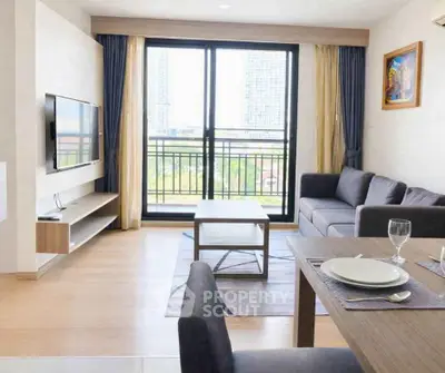 Modern living room with balcony view in high-rise apartment