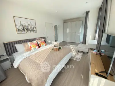 Spacious and bright bedroom with modern decor and ample storage