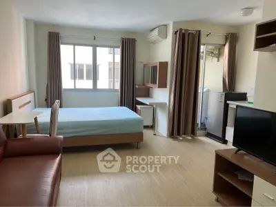 Spacious studio apartment with modern furnishings and natural light